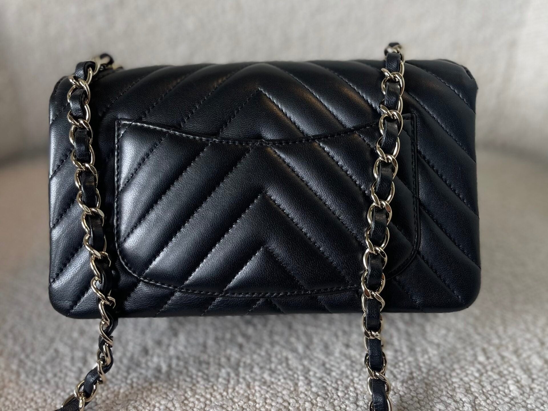 CHANEL Handbag Black Mini Rectangular Lambskin Chevron Light Gold Hardware -Knockoff
