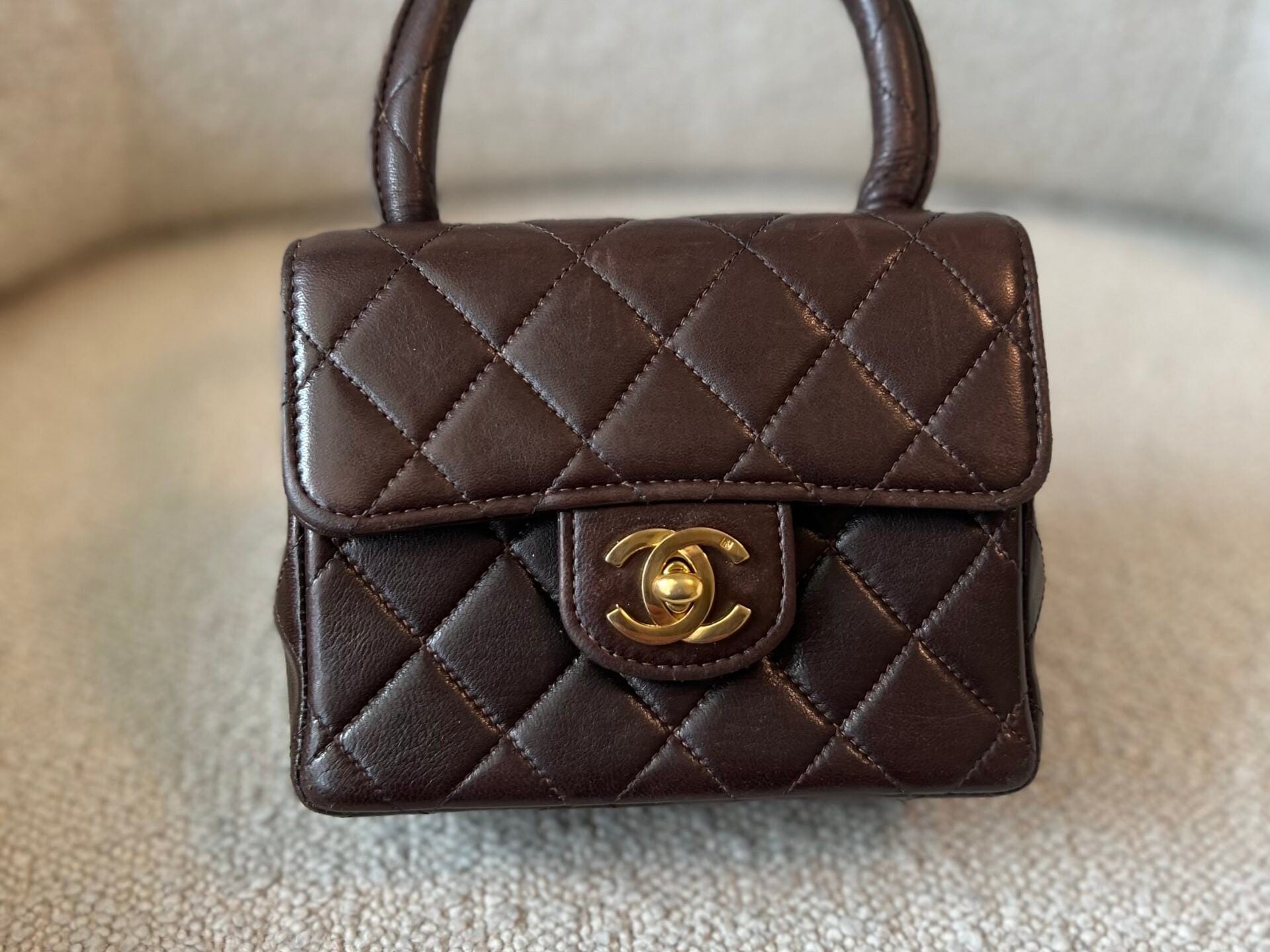 CHANEL Handbag Brown Vintage Brown Lambskin Quilted Micro Mini Kelly with Top Handle GHW -Knockoff
