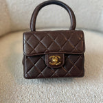 CHANEL Handbag Brown Vintage Brown Lambskin Quilted Micro Mini Kelly with Top Handle GHW -Knockoff
