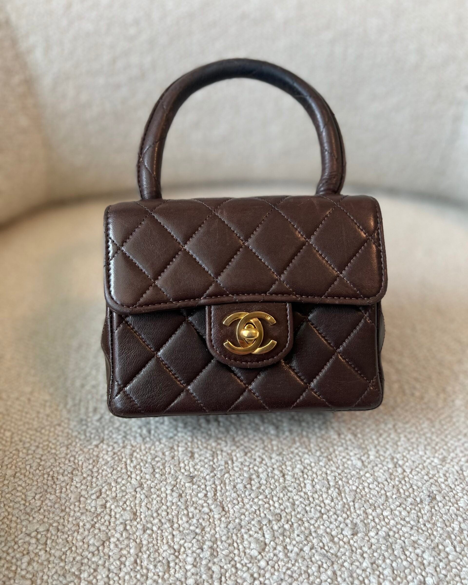 CHANEL Handbag Brown Vintage Brown Lambskin Quilted Micro Mini Kelly with Top Handle GHW -Knockoff
