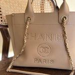 CHANEL Tote CHANEL LIGHT BEIGE MEDIUM DEAUVILLE SHOPPING TOTE STUDDED AGED HARDWARE -Knockoff
